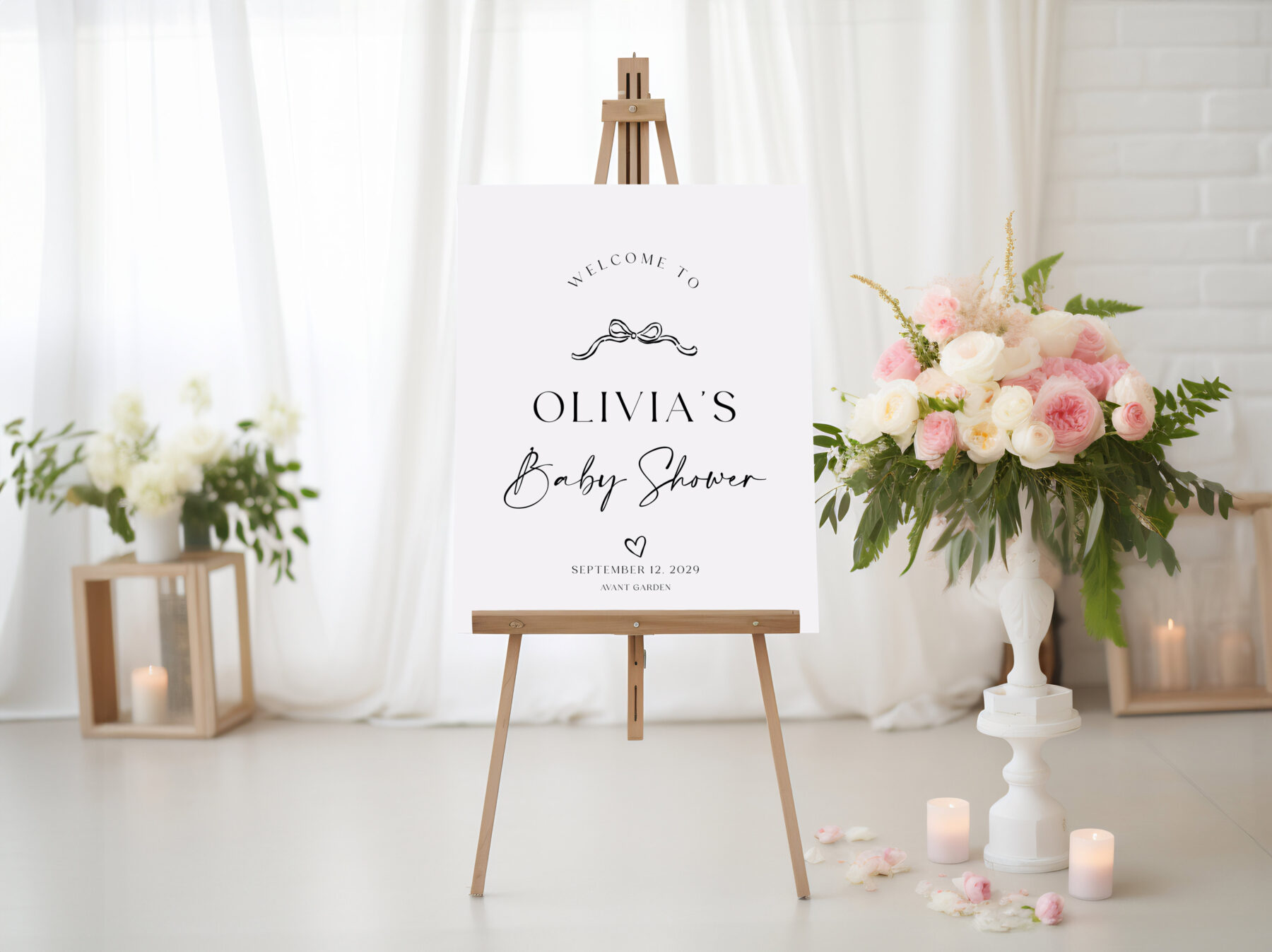 Baby Shower Welcome Sign - Bow Detail. A fine black bow and small heart accent with a script baby shower heading.