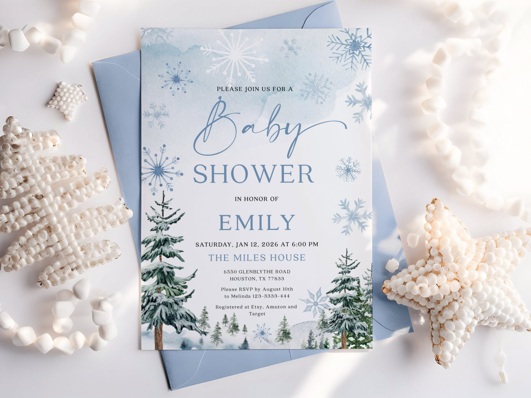 Blue Winter Baby Shower Invitation. Pale blue winter artwork, snowflakes, evergreen trees and baby shower lettering.