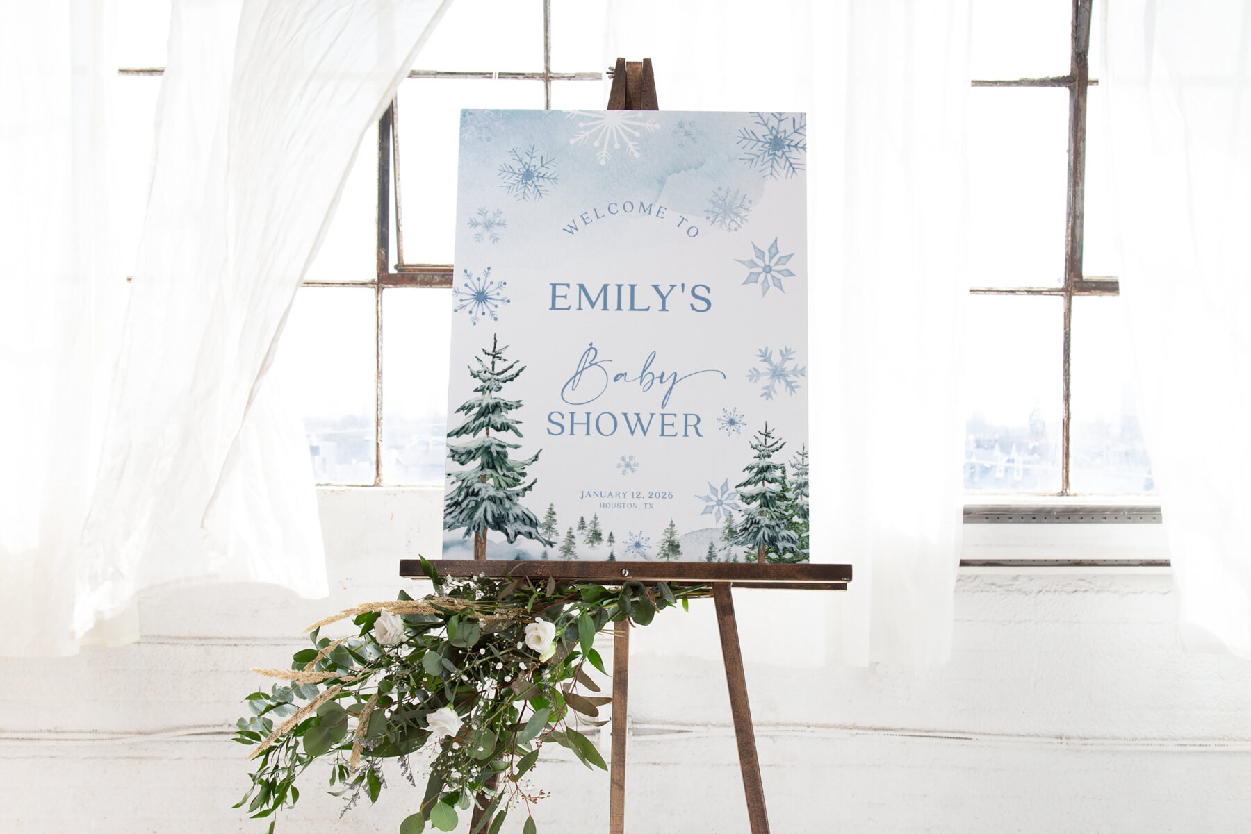 Blue Winter Baby Shower Welcome Sign - Name-First shown in a styled product mockup.
