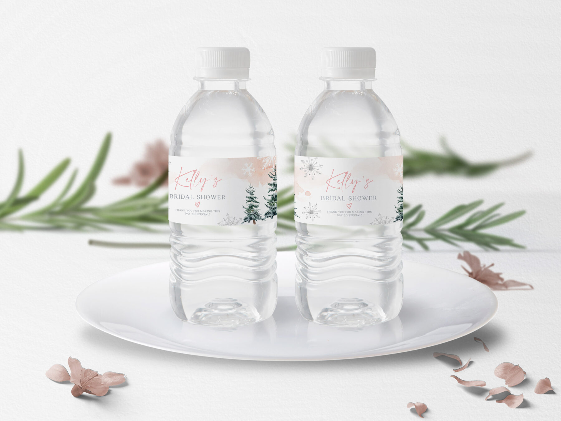 Pink Winter Water Bottle Labels - Canva Template shown in a styled product mockup.