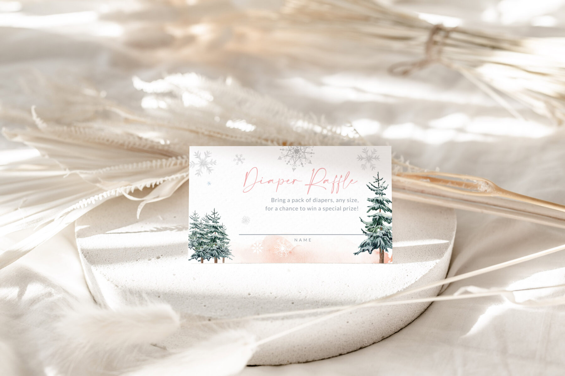 Pink Winter Diaper Raffle Ticket - Canva Template shown in a styled product mockup.